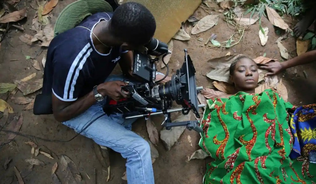A cameraman films a scene for the movie October 1, a police thriller directed by Kunle Afolayan, at a rural location in Ilaramokin village, southwest Nigeria.